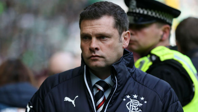 Rangers manager Graeme Murty looks on.