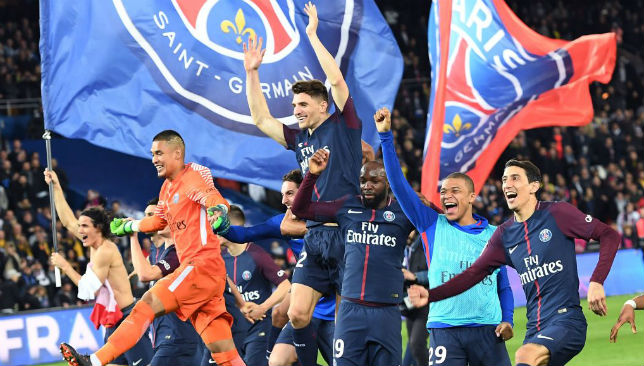 Paris Saint-Germain's players celebrate after winning the French League.