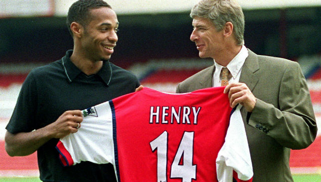 Thierry Henry (L) holds up his shirt with Manager Arsene Wenger