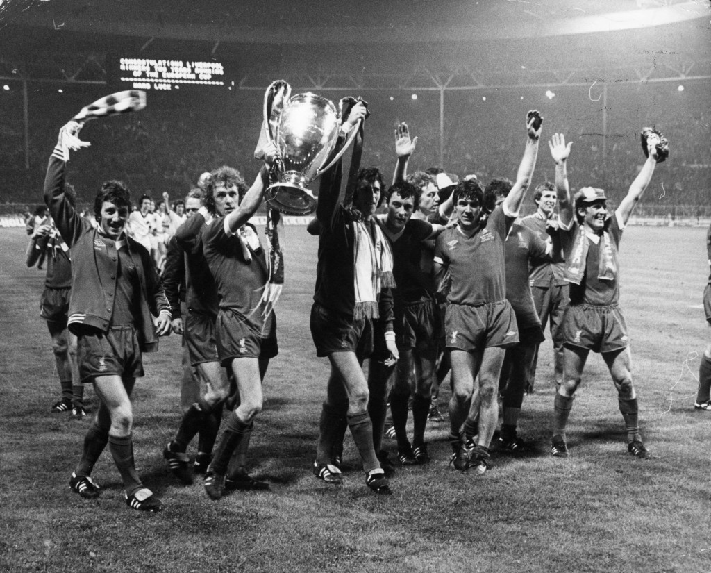 11th May 1978: The players of Liverpool Football Club carry the trophy on a lap of honour after their 1-0 victory over FC Bruges in the European Cup final at Wembley Stadium. From left to right are Jimmy Case, Phil Neal, Ray Clemence, Ray Kennedy, David Fairclough, Emlyn Hughes, Joey Jones, and the goal scorer, Kenny Dalglish. (Photo by David Ashdown/Keystone/Getty Images)