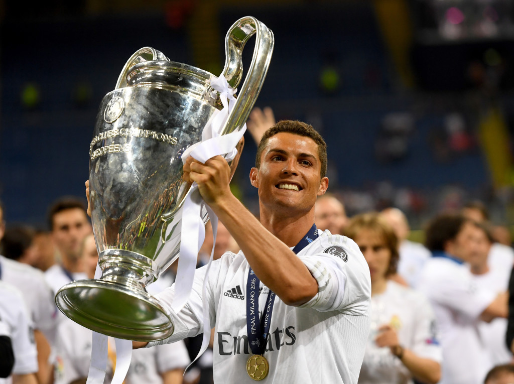 MILAN, ITALY - MAY 28: Cristiano Ronaldo of Real Madrid lifts the Champions League trophy after the UEFA Champions League Final match between Real Madrid and Club Atletico de Madrid at Stadio Giuseppe Meazza on May 28, 2016 in Milan, Italy. (Photo by Matthias Hangst/Getty Images)