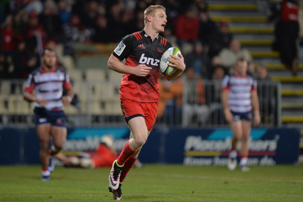 Stroll in the park: Johnny McNicholl goes over for a try in the Crusaders 85-26 cake-walk over the Rebels (Game No3 of the streak)