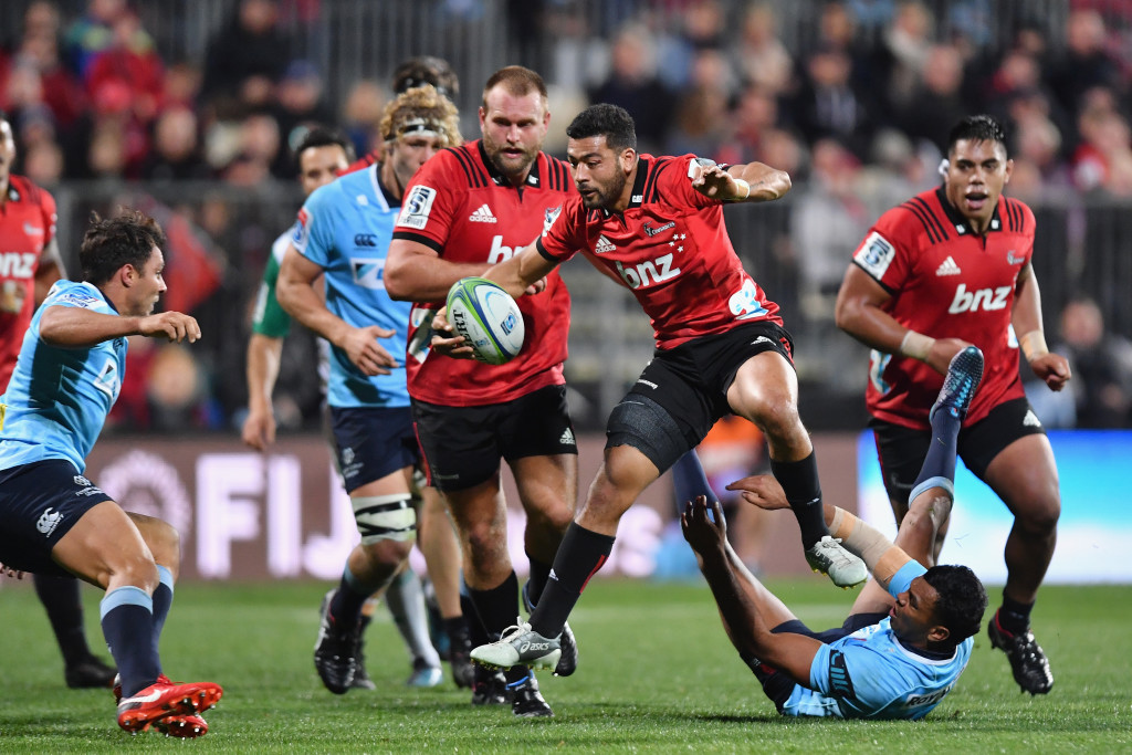 Narrowest margin: Richie Mo'unga leaps over a felled Kurtley Beale in a controversial moment from the Tahs 2-point loss to the Crusaders - Game No39 in the streak