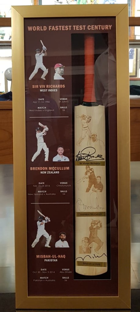 Very special: The signed bat by McCullum, Misbah and McCullum