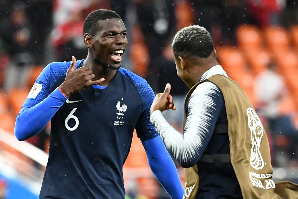 France's midfielder Paul Pogba (L) and France's defender Presnel Kimpembe (R) dance as they celebrate after winning at the end of the Russia 2018 World Cup Group C football match between France and Peru at the Ekaterinburg Arena in Ekaterinburg on June 21, 2018. (Photo by FRANCK FIFE / AFP) / RESTRICTED TO EDITORIAL USE - NO MOBILE PUSH ALERTS/DOWNLOADS (Photo credit should read FRANCK FIFE/AFP/Getty Images)