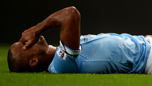 Vincent Kompany of Manchester City lies injured