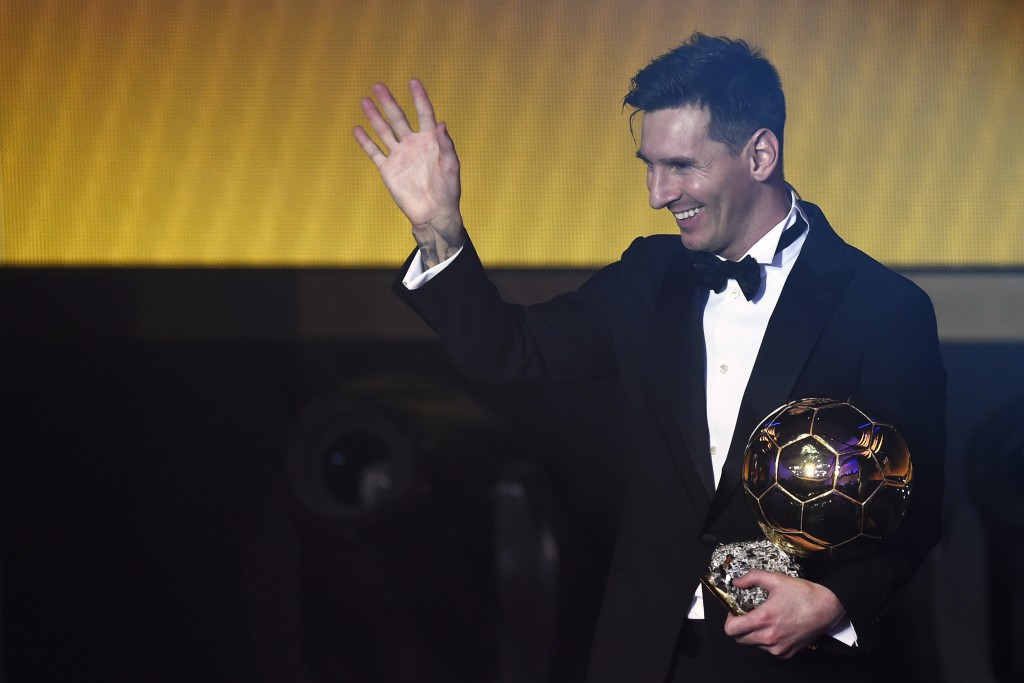 FC Barcelona and Argentina's forward Lionel Messi waves holding his trophy after receiving the 2015 FIFA Ballon dOr award for player of the year during the 2015 FIFA Ballon d'Or award ceremony at the Kongresshaus in Zurich on January 11, 2016. AFP PHOTO / OLIVIER MORIN / AFP / OLIVIER MORIN (Photo credit should read OLIVIER MORIN/AFP/Getty Images)