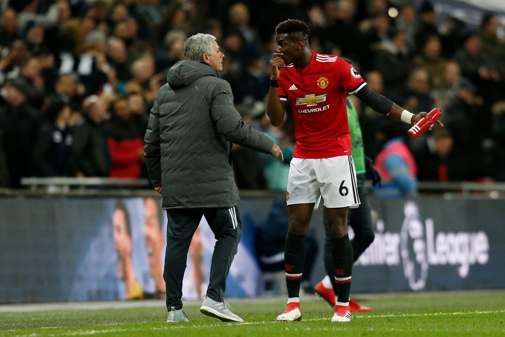 Manchester United's Portuguese manager Jose Mourinho (L) talks with Manchester United's French midfielder Paul Pogba (R) after the second Tottenham goal goes in during the English Premier League football match between Tottenham Hotspur and Manchester United at Wembley Stadium in London, on January 31, 2018. / AFP PHOTO / IKIMAGES / Ian KINGTON / RESTRICTED TO EDITORIAL USE. No use with unauthorized audio, video, data, fixture lists, club/league logos or 'live' services. Online in-match use limited to 45 images, no video emulation. No use in betting, games or single club/league/player publications. / (Photo credit should read IAN KINGTON/AFP/Getty Images)