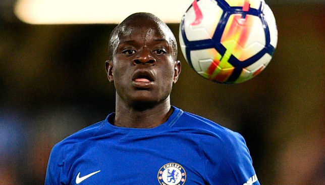 Chelsea midfielder N'Golo Kante stops for a chat and a photo with