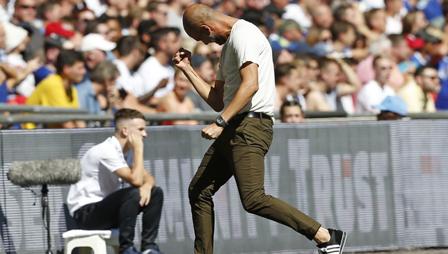 Pep Guardiola celebrates after the opening goal