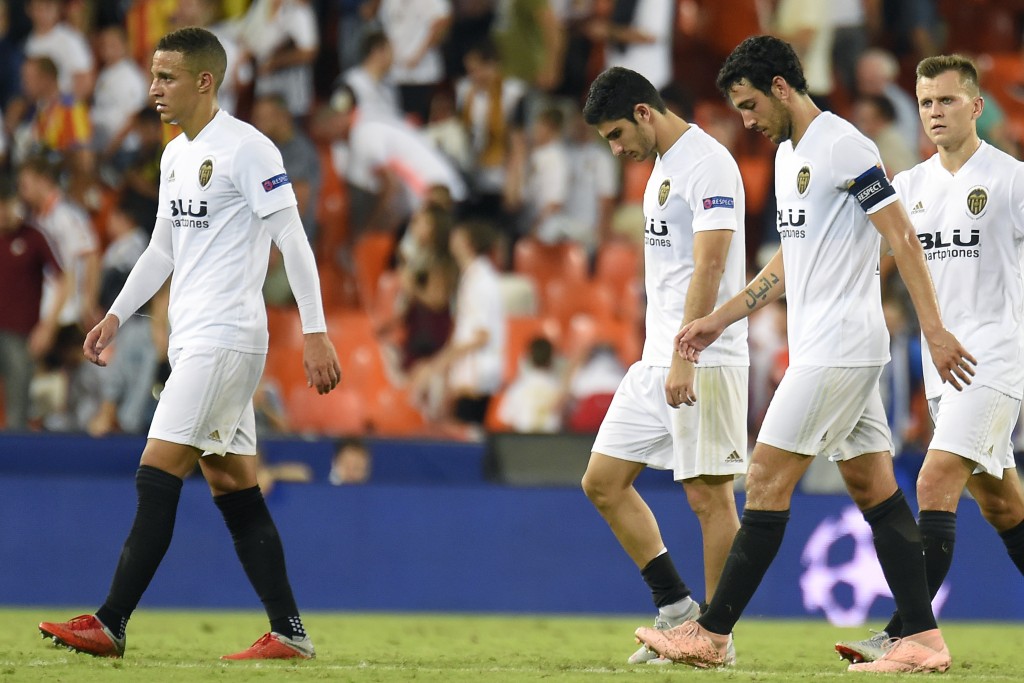 (FromL) Valencia's Brazilian forward Rodrigo Moreno, Valencia's Portuguese midfielder Manuel Guedes, Valencia's Spanish midfielder Dani Parejo and Valencia's Russian forward Denis Cheryshev react at the end of the UEFA Champions League group H football match between Valencia CF and Juventus FC at the Mestalla stadium in Valencia on September 19, 2018. (Photo by JOSE JORDAN / AFP) (Photo credit should read JOSE JORDAN/AFP/Getty Images)