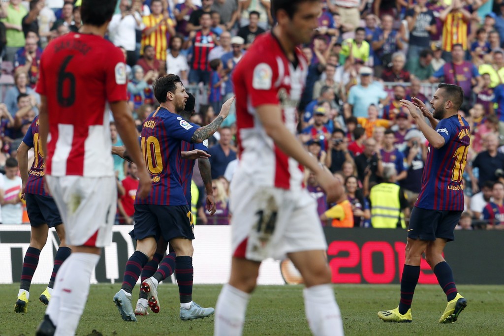 Barcelona's Spanish defender Jordi Alba (r) joins in celebrations versus Athletic Bilbao.
