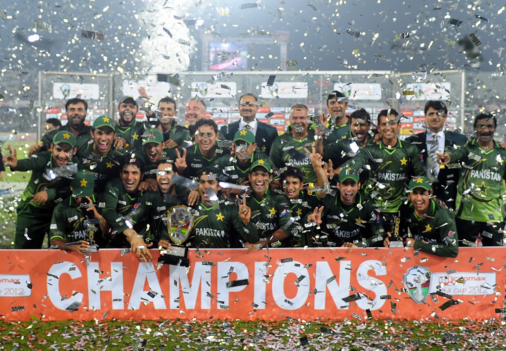Pakistan's cricketeers pose for a photo with the tournament trophy following the one day international (ODI) Asia Cup cricket final match between Bangladesh and Pakistan at The Sher-e-Bangla National Cricket Stadium in Dhaka on March 22, 2012. AFP PHOTO/Munir uz ZAMAN (Photo credit should read MUNIR UZ ZAMAN/AFP/Getty Images)