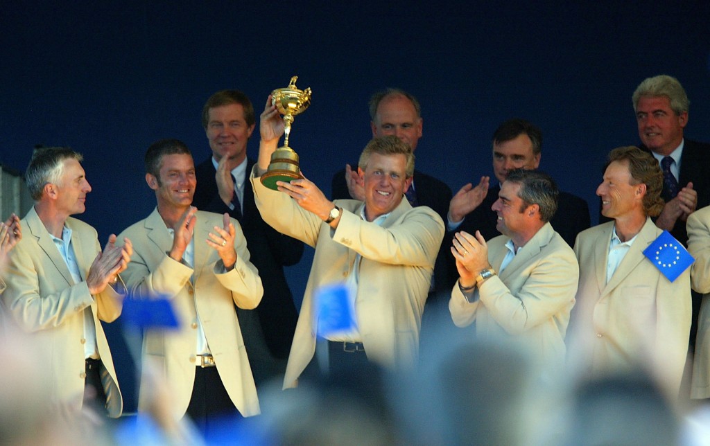 Colin Montgomerie holds the Ryder Cup trophy during the closing ceremony
