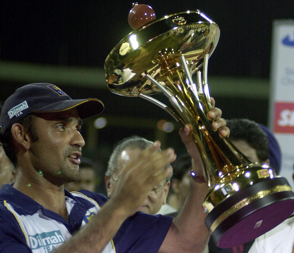 COLOMBO, SRI LANKA: Sri Lankan cricket captain, Marvan Atapattu holds the trophy up high as he celebrates beating India at R. Premadasa International Cricket Ground in Colombo, 01 August 2004, in the final of the ODI Asia Cup. India with a total of 203 runs were chasing Sri Lanka's innings score of 228 runs with 9 wickets in the 50 overs. AFP PHOTO/Sena Vidanagama (Photo credit should read SENA VIDANAGAMA/AFP/Getty Images)