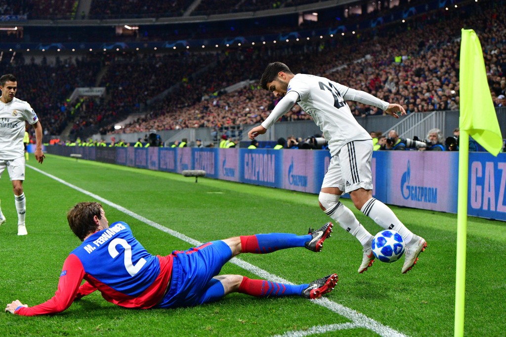 CSKA Moscow's Russian defender Mario Fernandes and Real Madrid's Spanish midfielder Marco Asensio vie for the ball during the UEFA Champions League group G football match between PFC CSKA Moscow and Real Madrid CF at the Luzhniki stadium in Moscow on October 2, 2018. (Photo by Mladen ANTONOV / AFP) (Photo credit should read MLADEN ANTONOV/AFP/Getty Images)