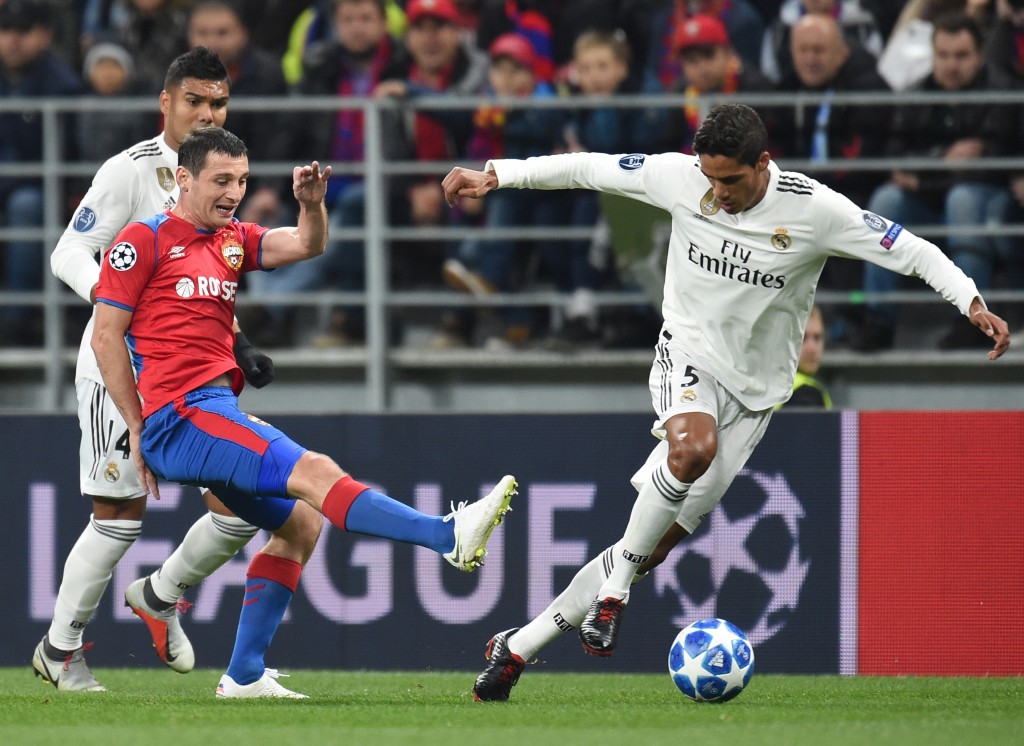 MOSCOW, RUSSIA - OCTOBER 02: Alan Dzagoev (L) of PFC CSKA Moscow is challenged by Raphael Varane of Real Madrid during the Group G match of the UEFA Champions League between CSKA Moscow and Real Madrid at the Luzhniki Stadium on October 02, 2018 in Moscow, Russia. (Photo by Epsilon/Getty Images)