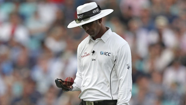 Umpire Kumar Dharmasena inspects a Duke ball during the England-India Test series.