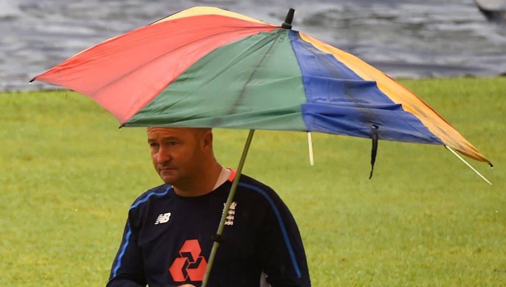 Coach Paul Farbrace leaves the ground after a practice match was called off due to heavy rain 