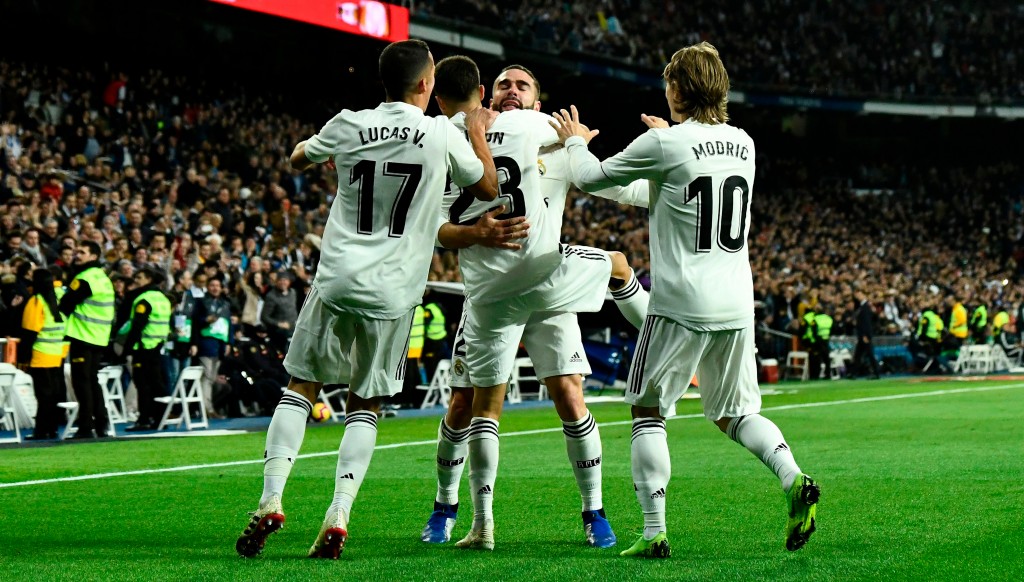Madrid players rush to congratulate Dani Carvajal who created the opening goal.
