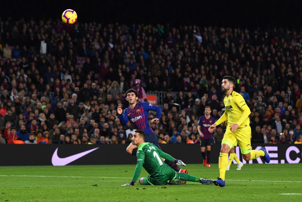 Carles Alena of Barcelona scores his team's second goal past Sergio Asenjo of Villareal 