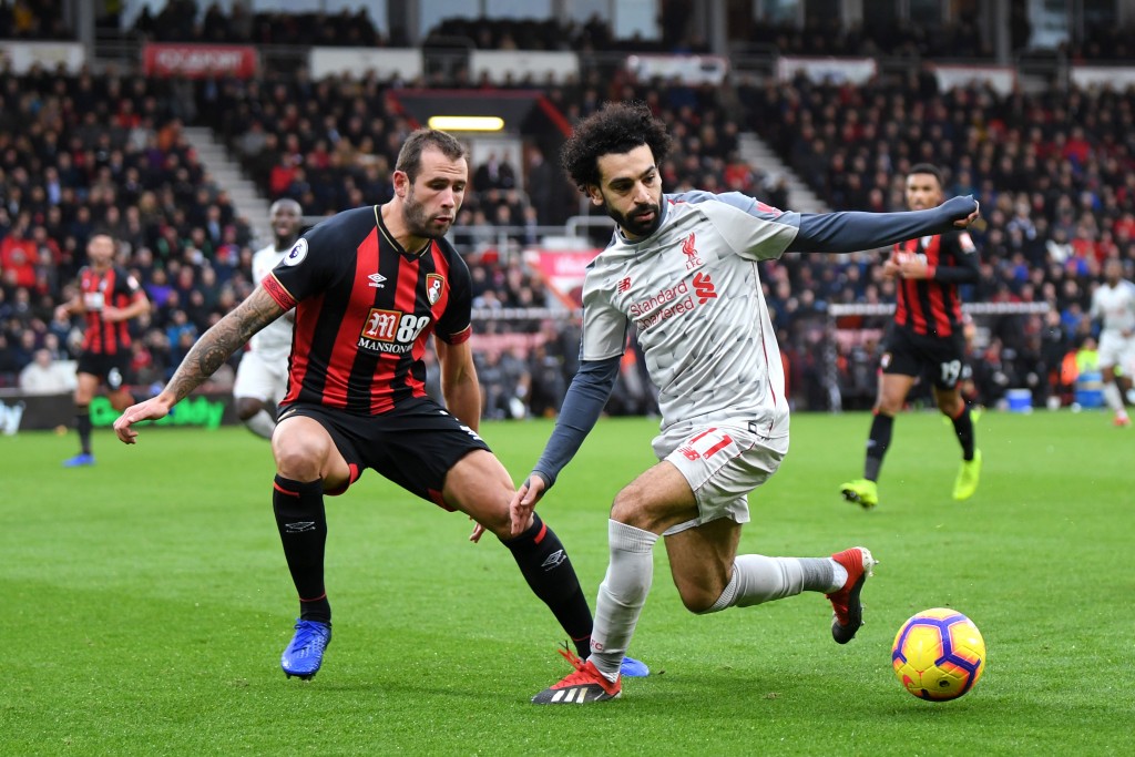 Mohamed Salah of Liverpool is challenged by Steve Cook of AFC Bournemouth during the Premier League match between AFC Bournemouth and Liverpool FC 