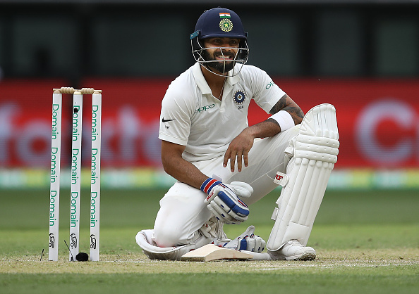PERTH, AUSTRALIA - DECEMBER 15: Virat Kohli of India reacts after diving to make his ground during day two of the second match in the Test series between Australia and India at Perth Stadium on December 15, 2018 in Perth, Australia. (Photo by Ryan Pierse/Getty Images)