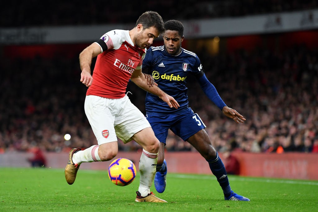 LONDON, ENGLAND - JANUARY 01: Sokratis Papastathopoulos of Arsenal and Ryan Sessegnon of Fulham during the Premier League match between Arsenal FC and Fulham FC at Emirates Stadium on January 1, 2019 in London, United Kingdom. (Photo by Justin Setterfield/Getty Images)
