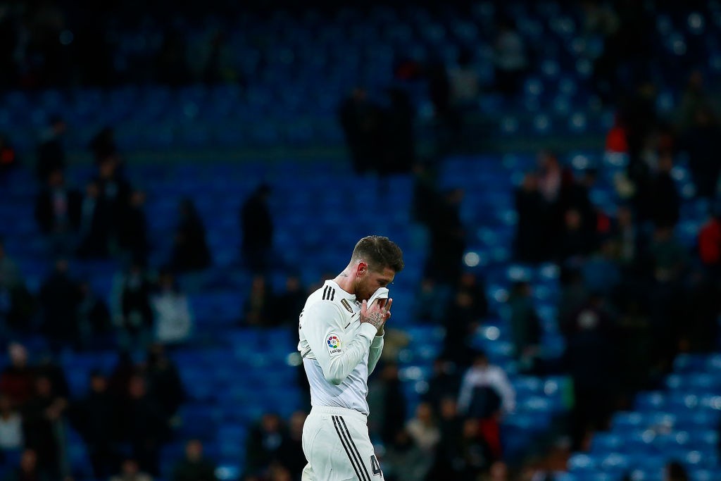 Real Madrid defender Sergio Ramos in front of empty seats 