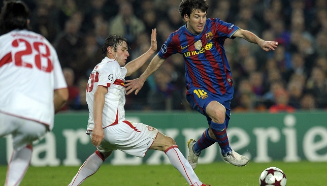 Christian Trasch (l) challenging Lionel Messi in 2010.