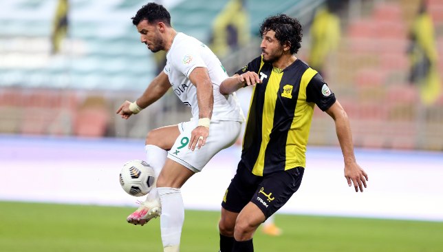 Al Ahli Jeddah striker Omar Al Somah (l) challenged by Al Ittihad's Ahmed Hegazy (EPA).